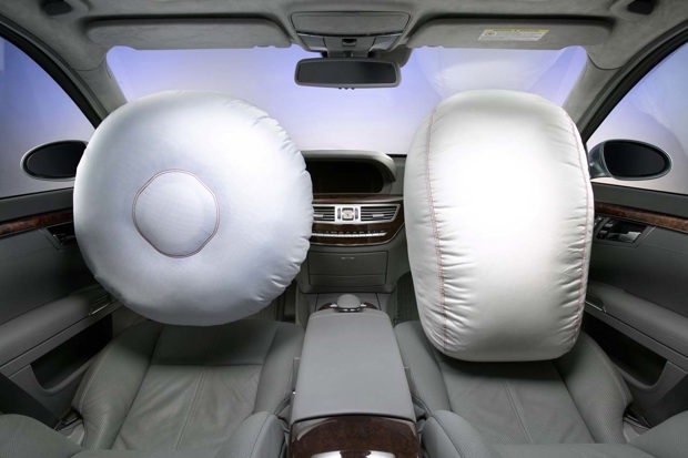 General Motors is generally credited with being first to install airbags in a production vehicle. It's 'air cushion restraint system' (ACRS) was installed in a few 1973 Chevrolet Impala sedans, and later, in the Oldsmobile Toronado. Check out this video about the now-rare 